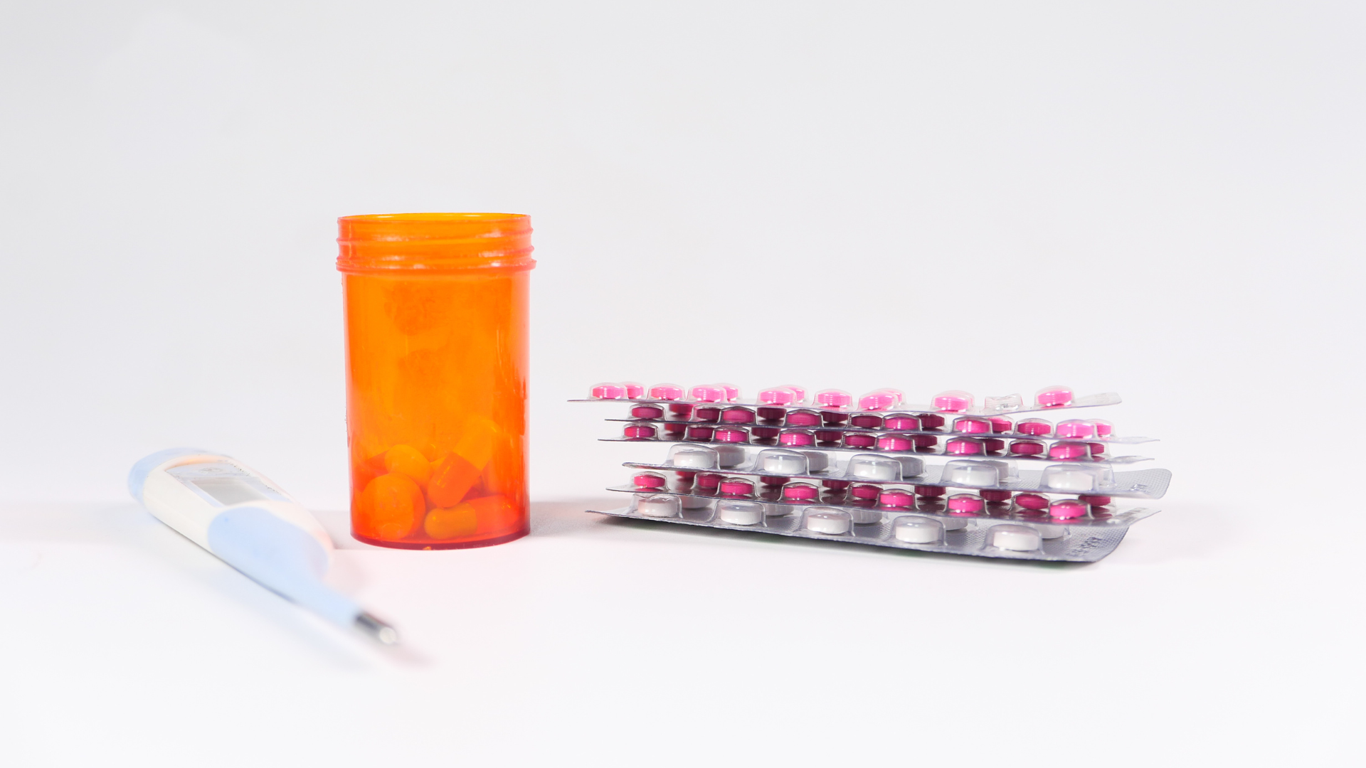 Blister pack medication and drugs in an orange medication bottle